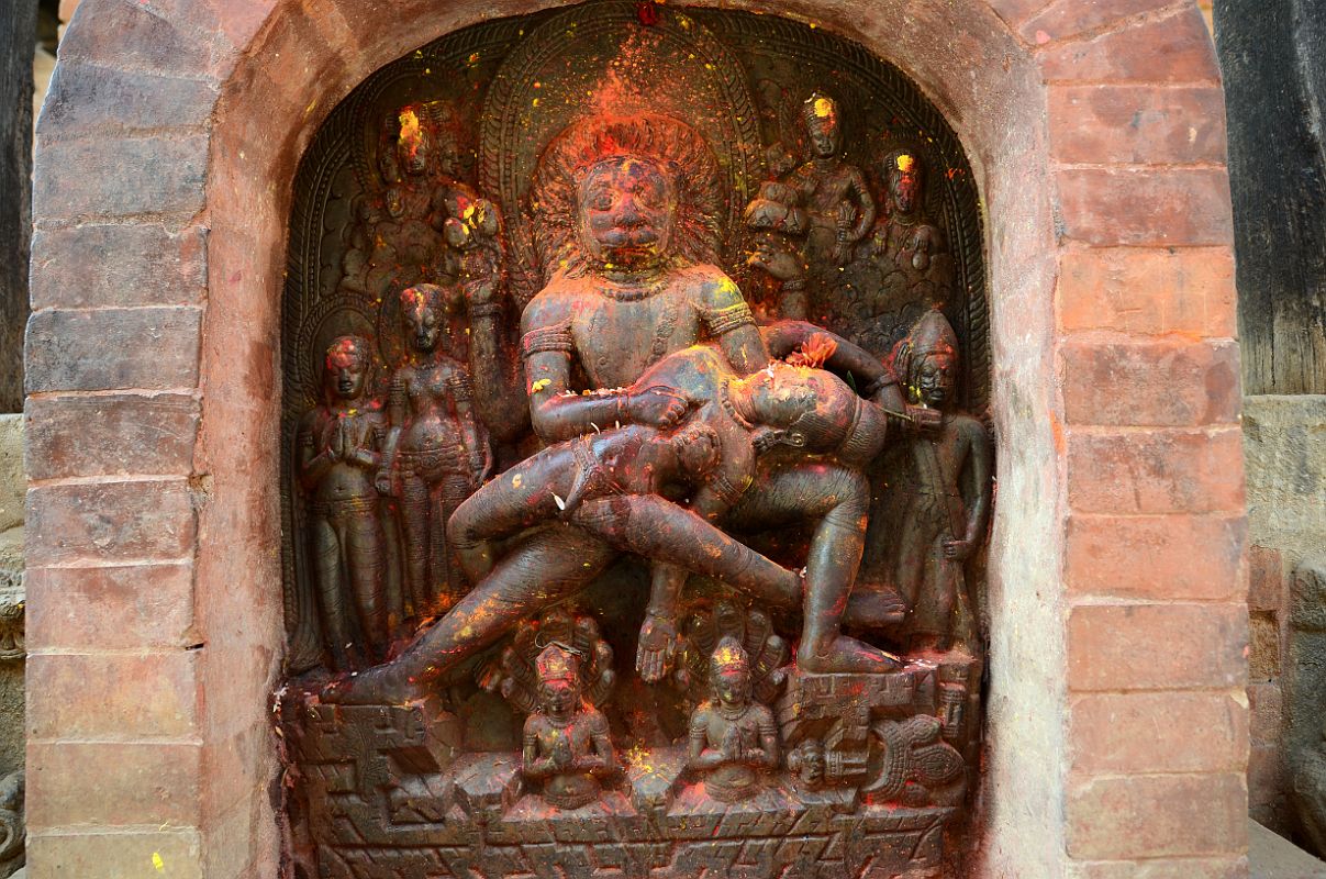 Kathmandu Changu Narayan 12 Vishnu Half-Man Half-Lion Narsingha Disembowels A Demon Just past the Vishnu Vikrantha statue in front of the Lakshmi Narayan Temple is a beautiful 11C or 12C Vishnu statue in the form of the half-man, half-lion Narasingha who disembowels a demon lying on his knees.